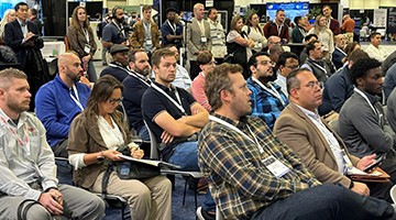 attendees listening carefully on keynotes on the expo floor
